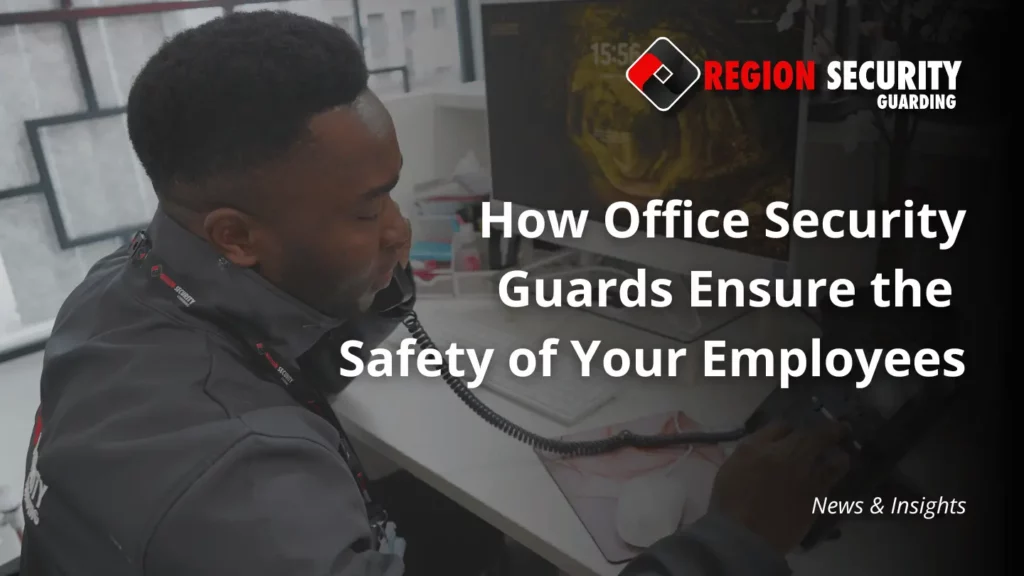 A security guard sat at the reception of an office, on the phone, with a text overlay that says "How Office Security Guards Ensure the Safety of Your Employees"