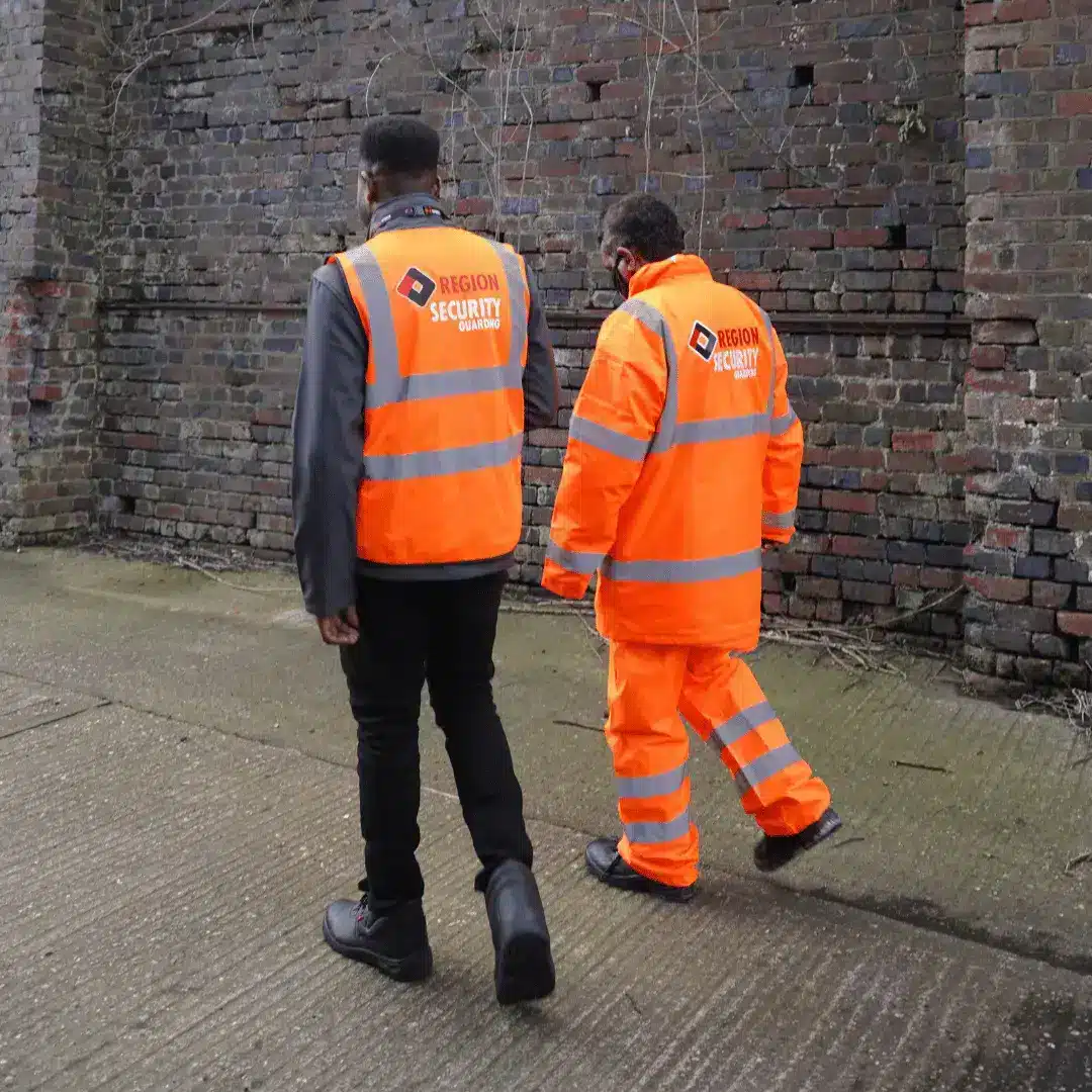 A pair of security guards walking side-by-side on a manned guarding Middlesbrough site