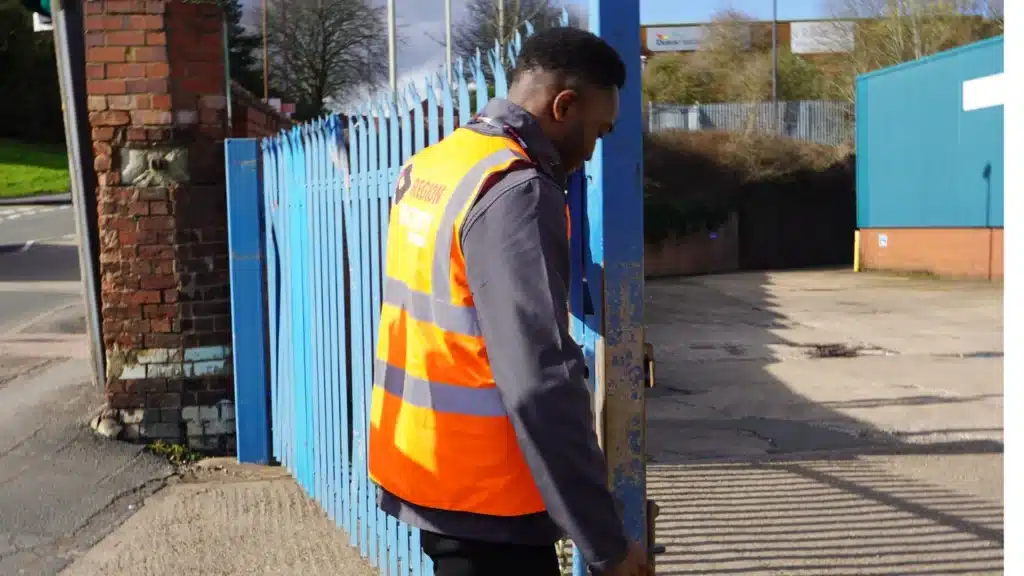 One of our security guards showing value of physical security by ensuring gate is secured