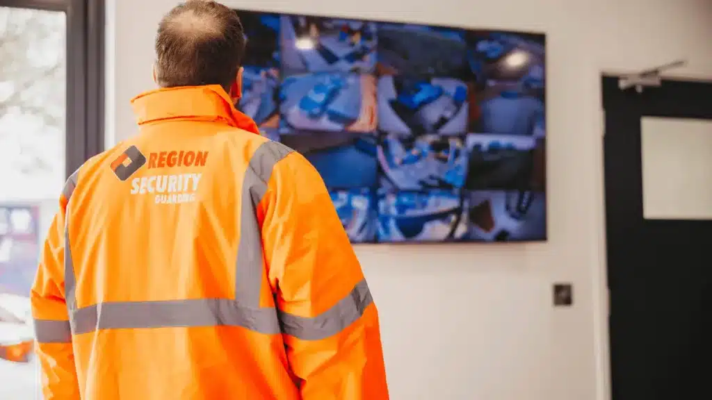 A security guard watching the CCTV of the site they're protecting