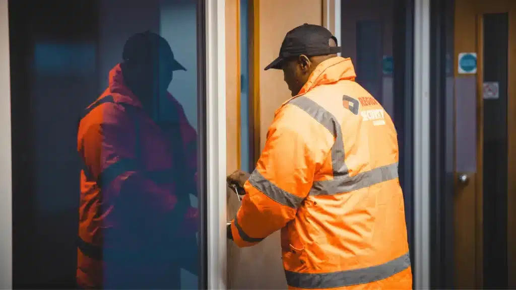 A security guard locking up an office suite