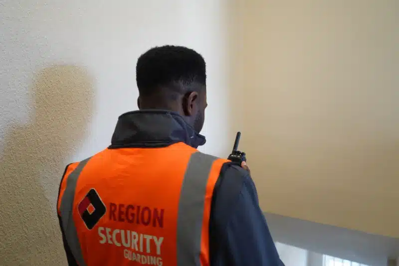 A Eastwood security guard walking downstairs of a building