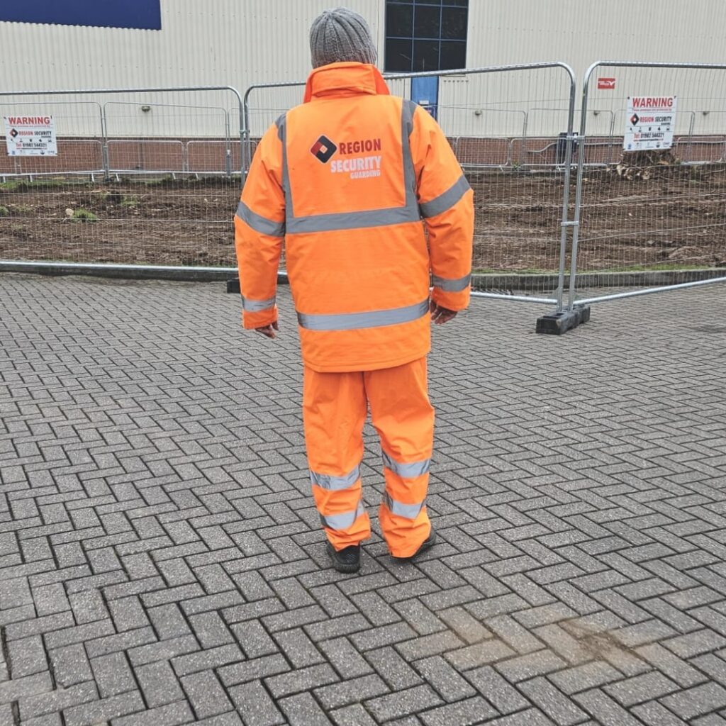 A Loughborough construction manned guarding officer conducting a security inspection around a building site