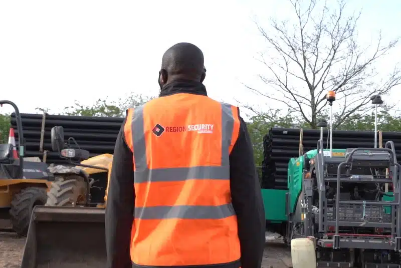 A Nottingham construction security guard checking the construction equipment