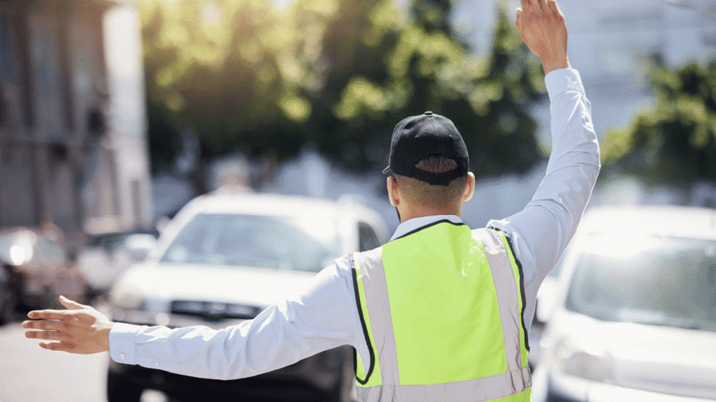 A West Midlands banksman directing cars