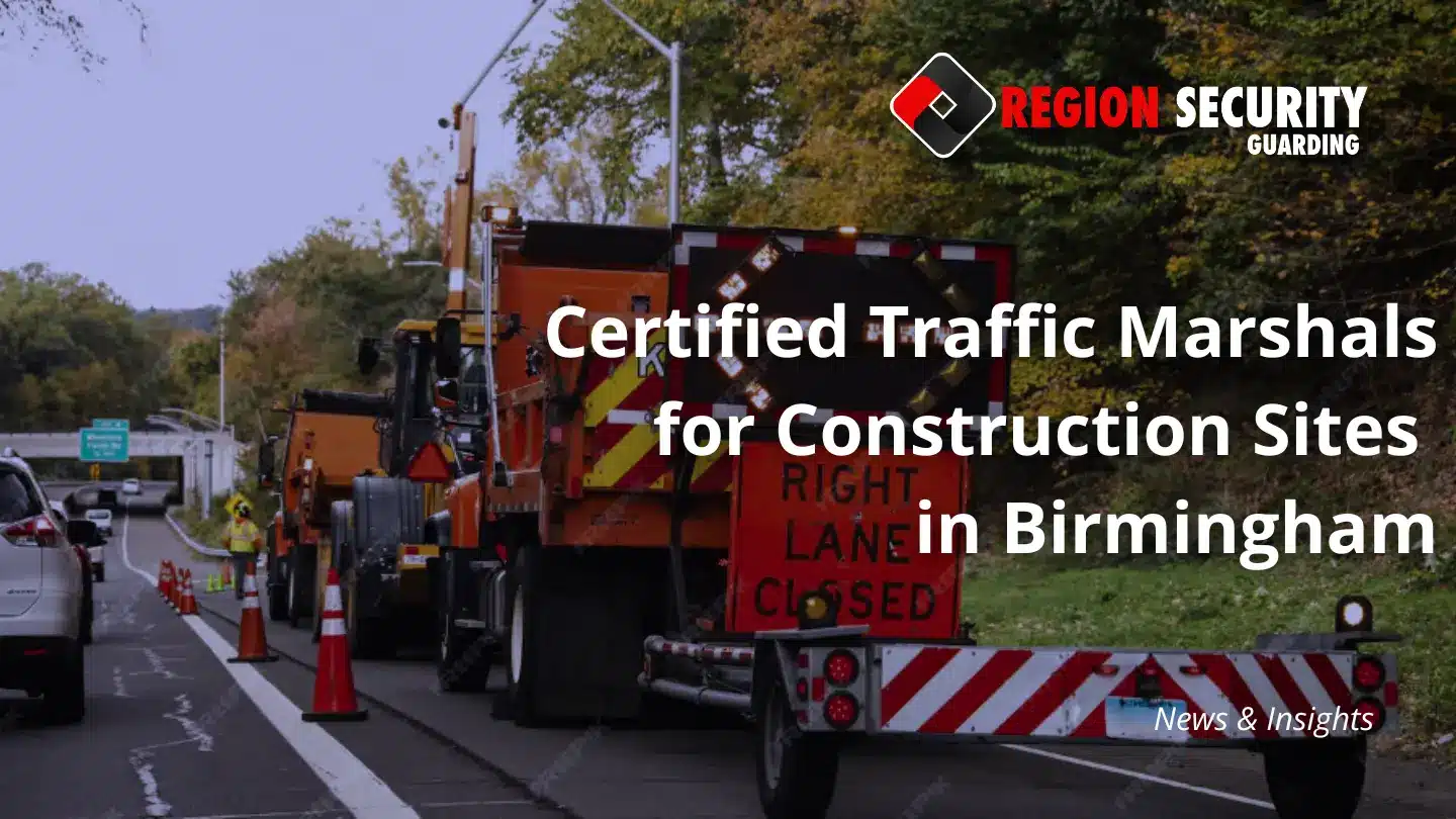 A traffic marshall ensuring the construction site vehicle move safely within the congested city environment in Birmingham.