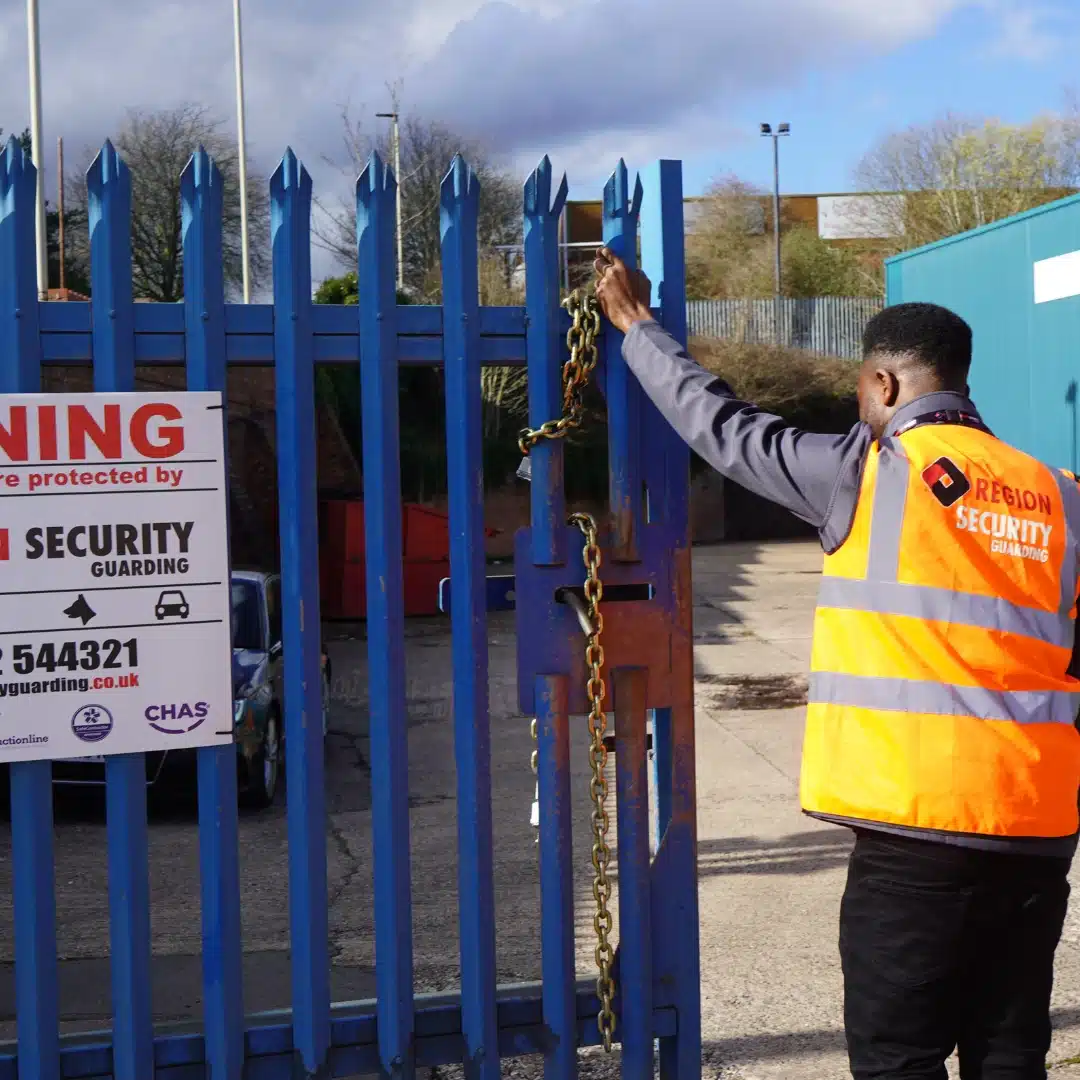 Manned guarding officer securing warehouse entrance in Loughborough