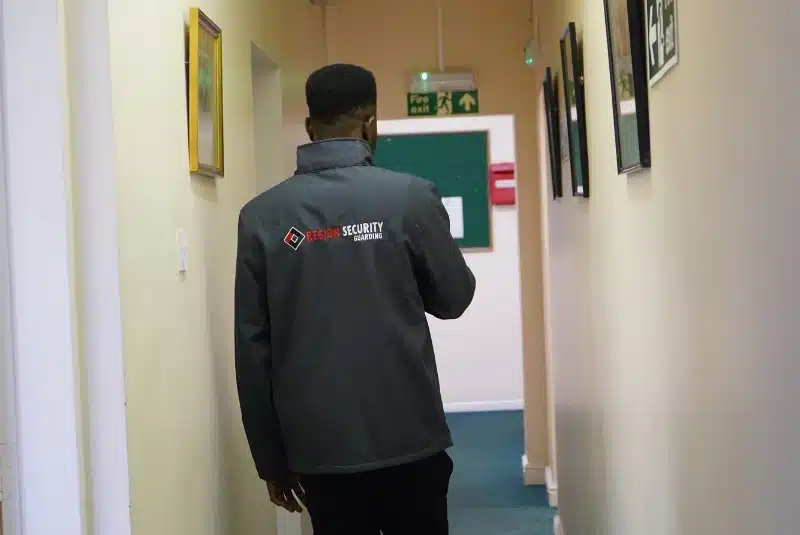 Nottingham manned guard patrolling a building corridor
