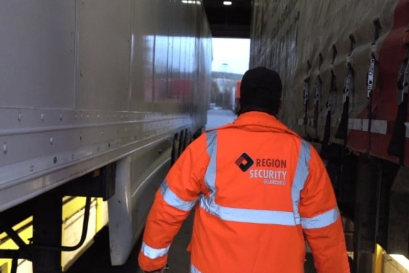 SIA-approved security guard inspecting warehouse in Loughborough