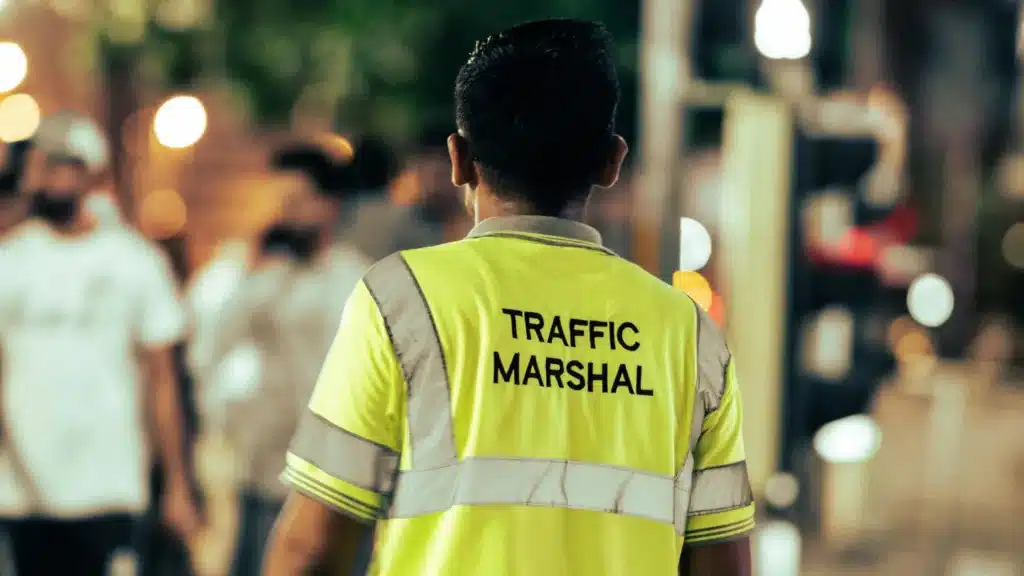 A traffic marshall inspecting the construction site and pedestration safety while the construction works is going on in Birmingham