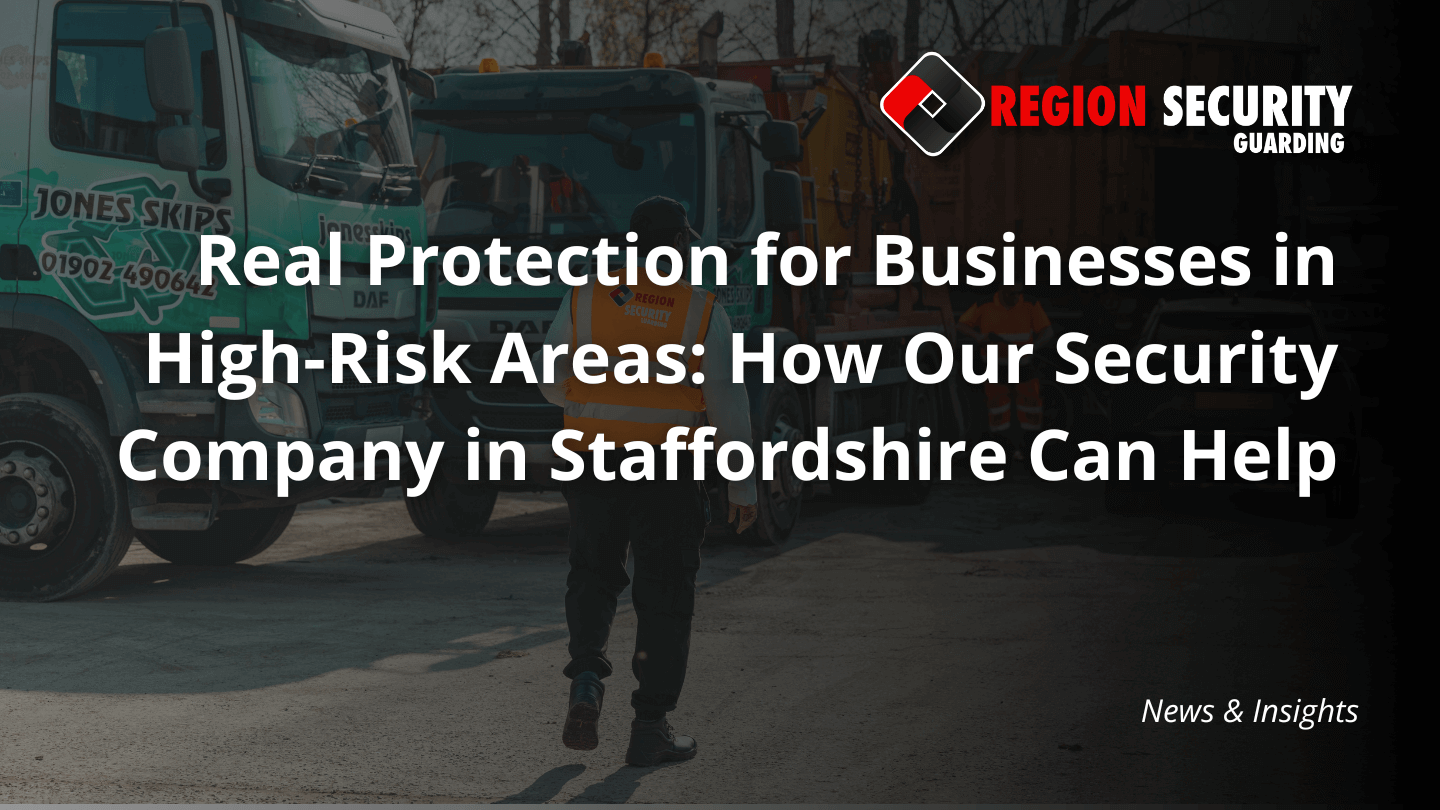 A guard from our security company in Staffordshire is seen patrolling an industrial yard with large trucks