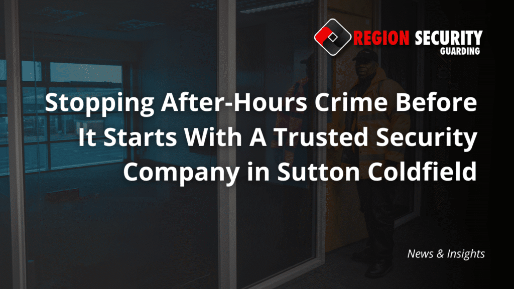 A guard from our security company in Sutton Coldfield stands by an office door and large windows, on a security check of the premises