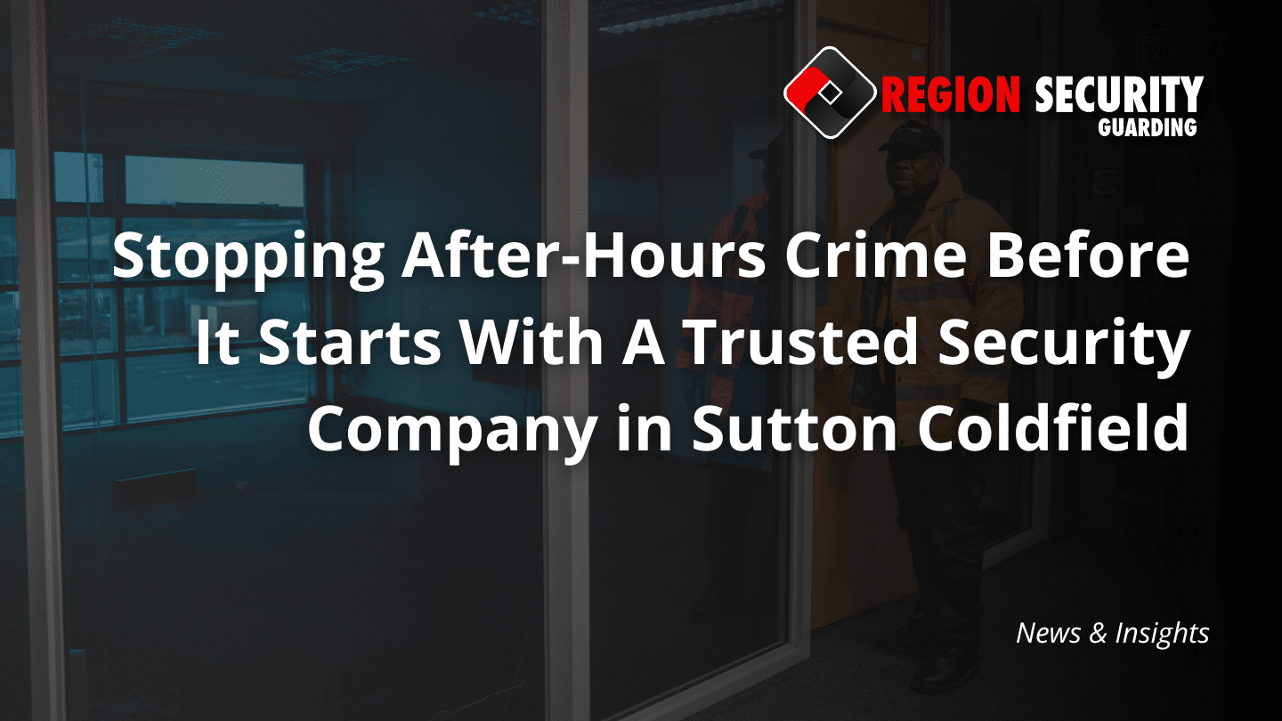 A guard from our security company in Sutton Coldfield stands by an office door and large windows, on a security check of the premises