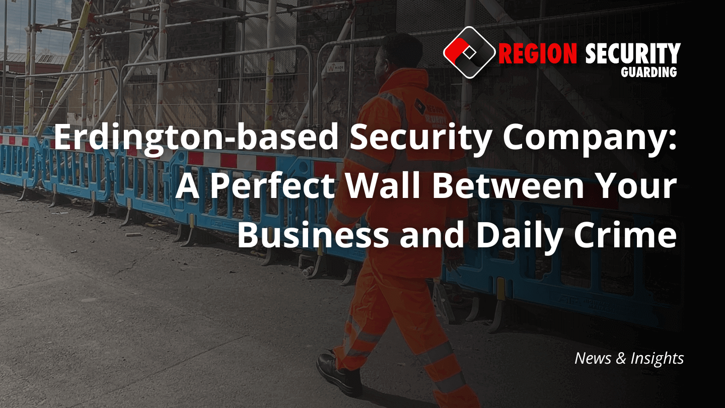 A security guard from our Erdington-based security company is seen walking past blue construction barriers