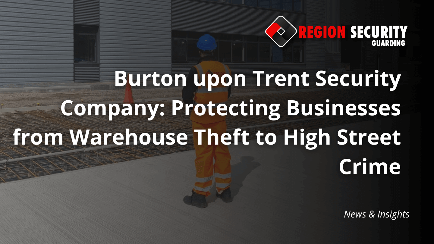 A security guard in a hard hat and high-visibility clothing stands on a concrete area at a Burton upon Trent security company protected warehouse site