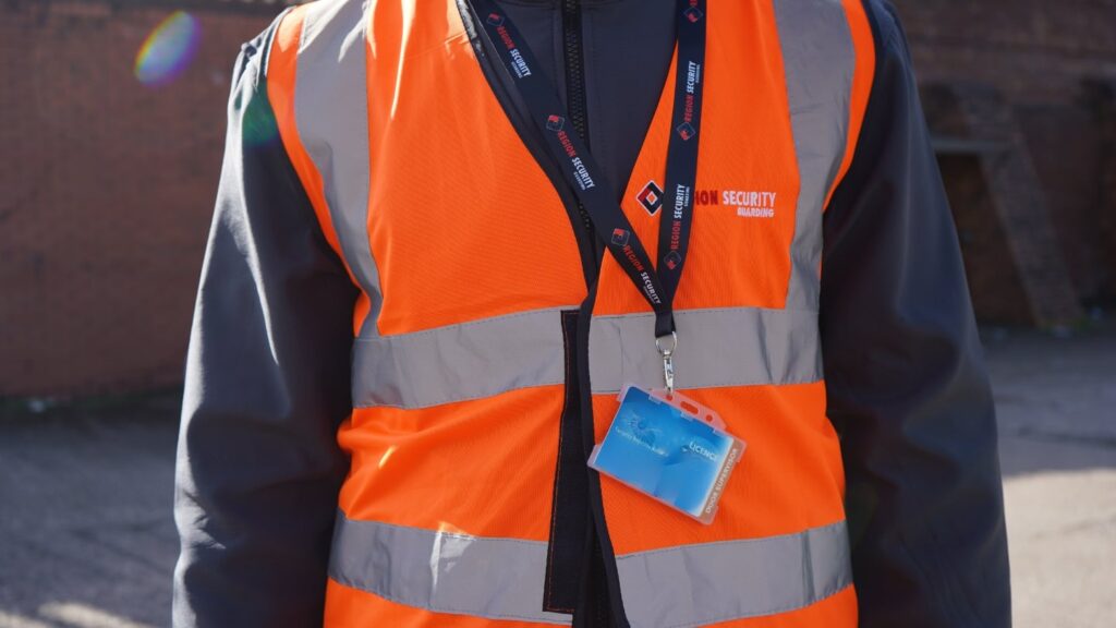 Close-up of a professional SIA-licensed security guard's uniform and badge for event security in Telford.