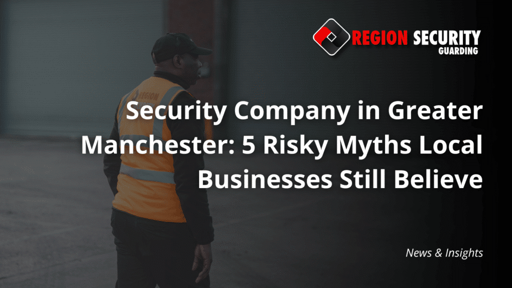 A guard from a security company in Greater Manchester stands on patrol outside a warehouse or industrial building.