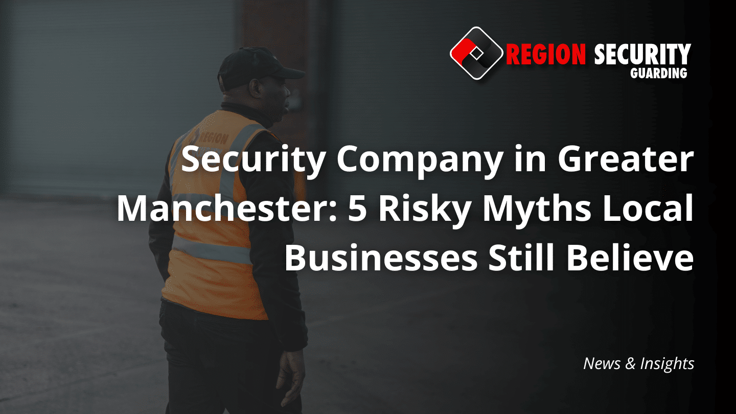 A guard from a security company in Greater Manchester stands on patrol outside a warehouse or industrial building.