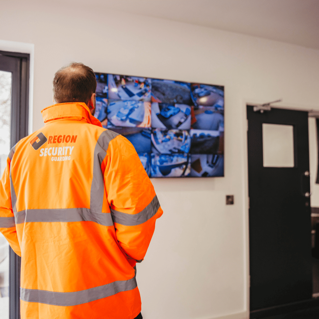  A security guard from region security guarding monitoring CCTV cameras