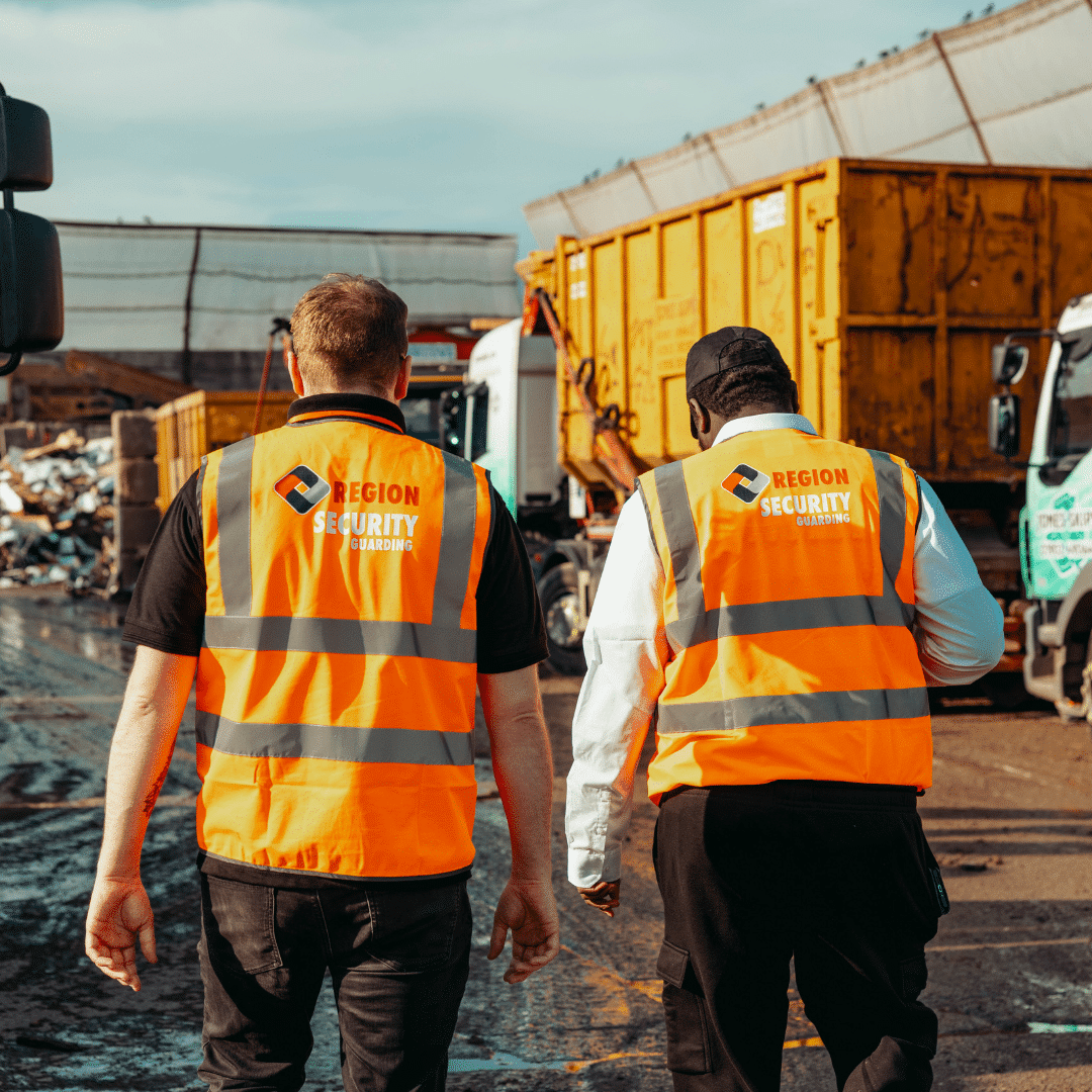Two manned guards from region security guarding surveying an industrial site
