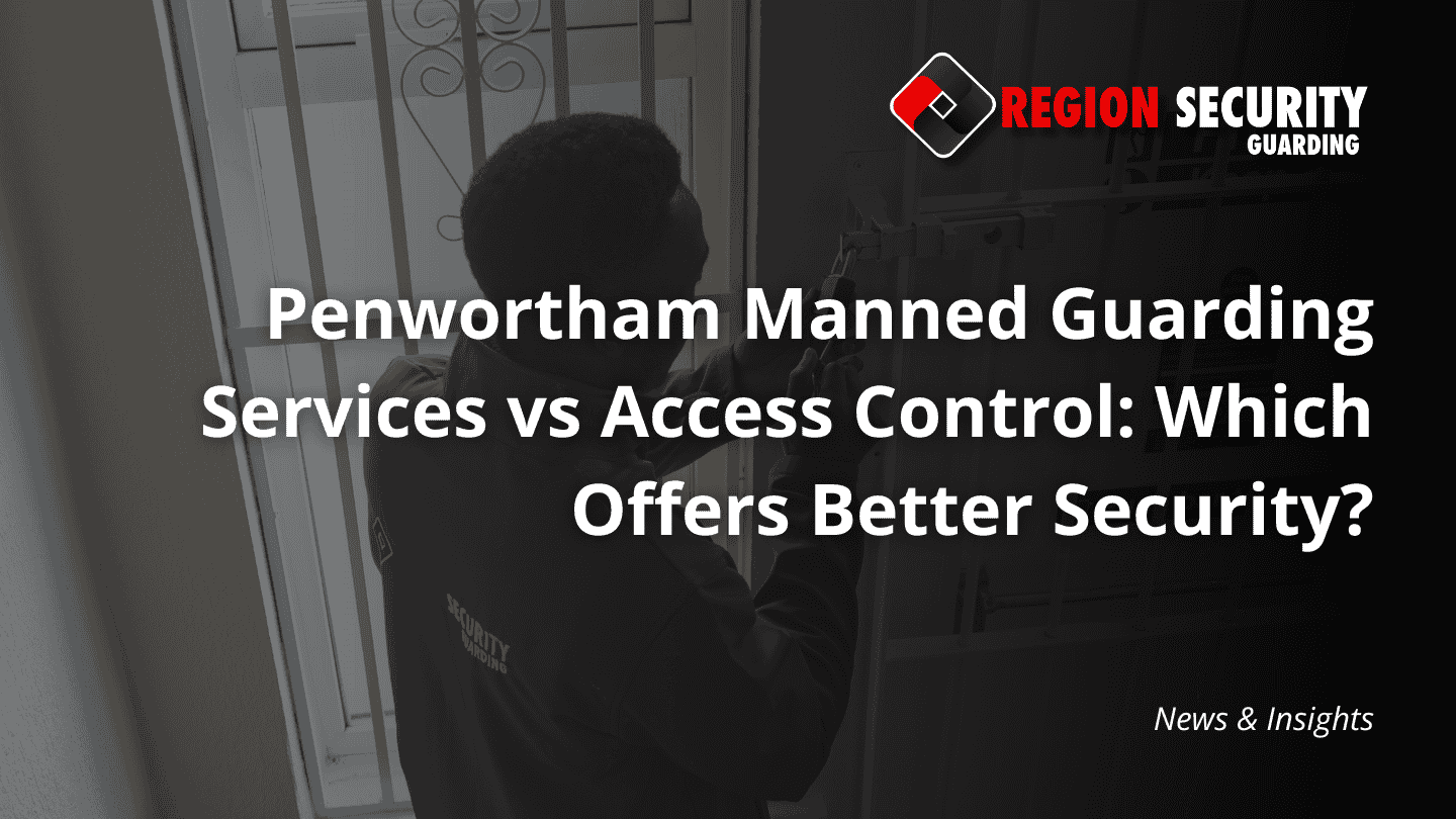 A professional security guard providing Penwortham manned guarding services, actively securing the entrance of a building.