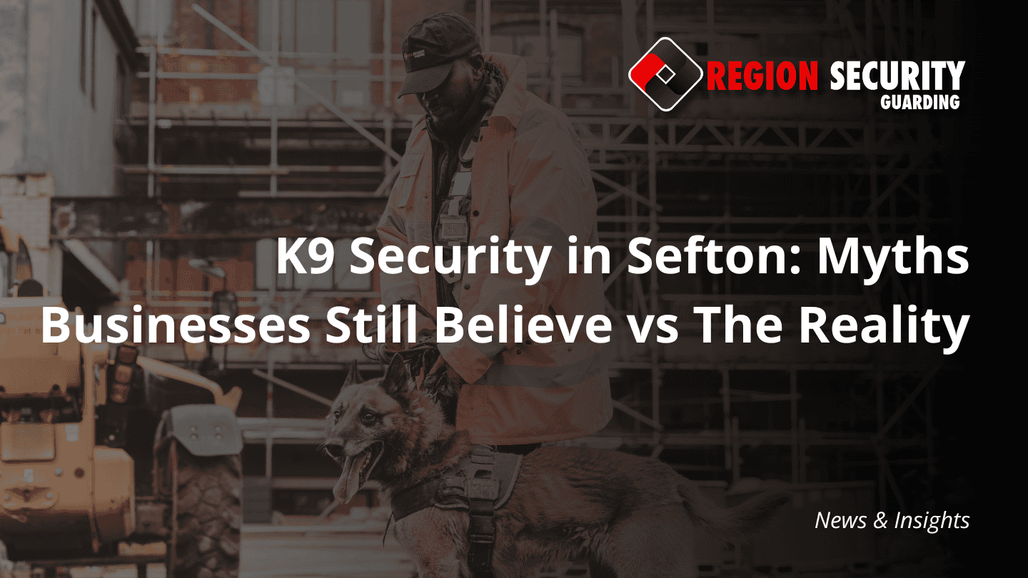 A dog handler, providing K9 security in Sefton, stands with a security dog on a construction or industrial site.