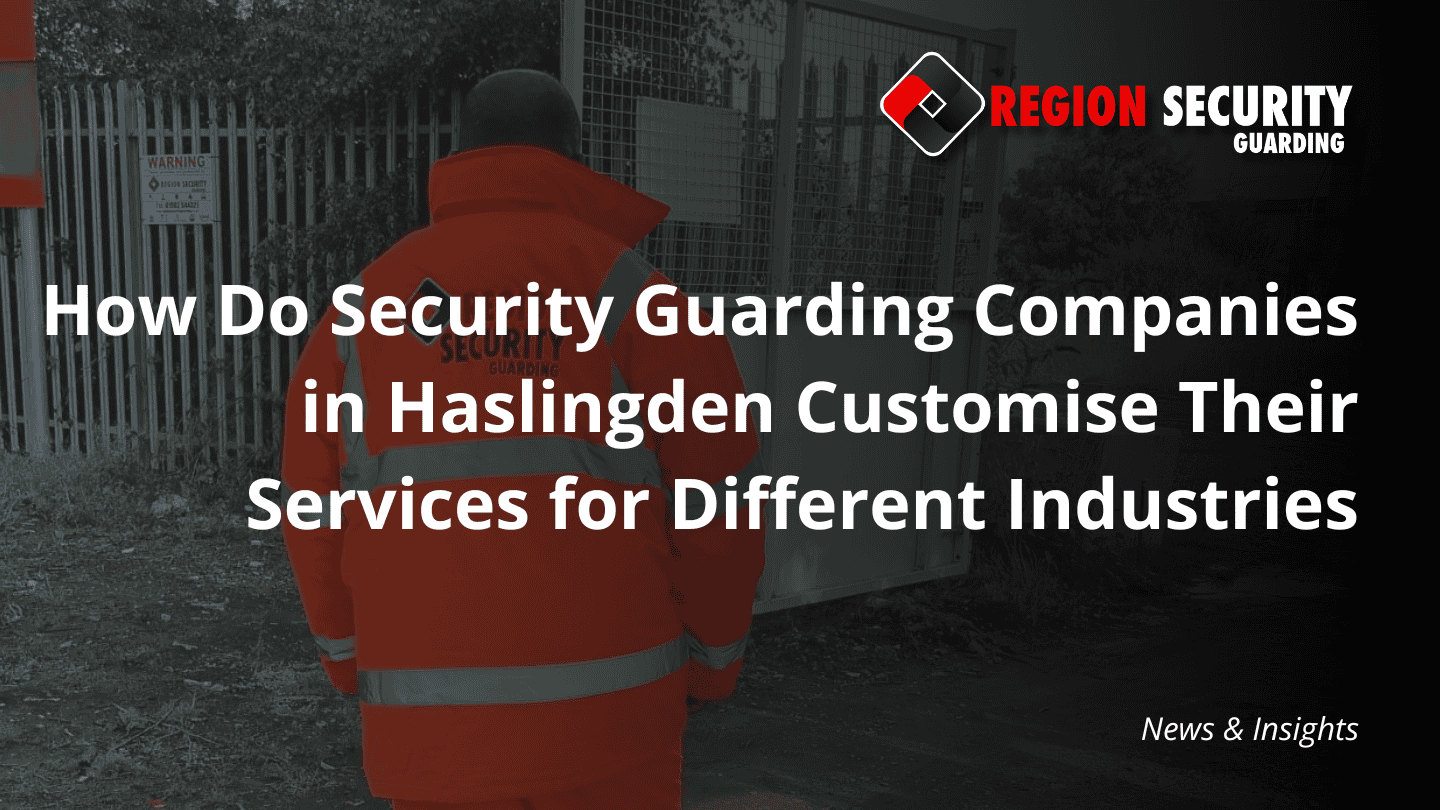 A professional guard stands on duty near an industrial gate, illustrating the on-site presence provided by security guarding companies in Haslingden.