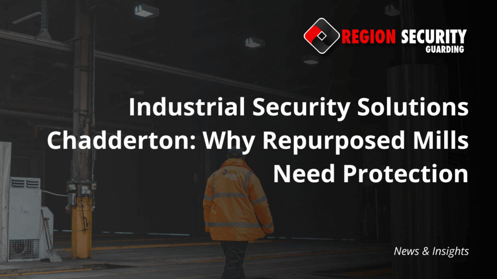 A uniformed security guard stands in a large industrial space with exposed structural elements, a classic target for industrial security solutions Chadderton.
