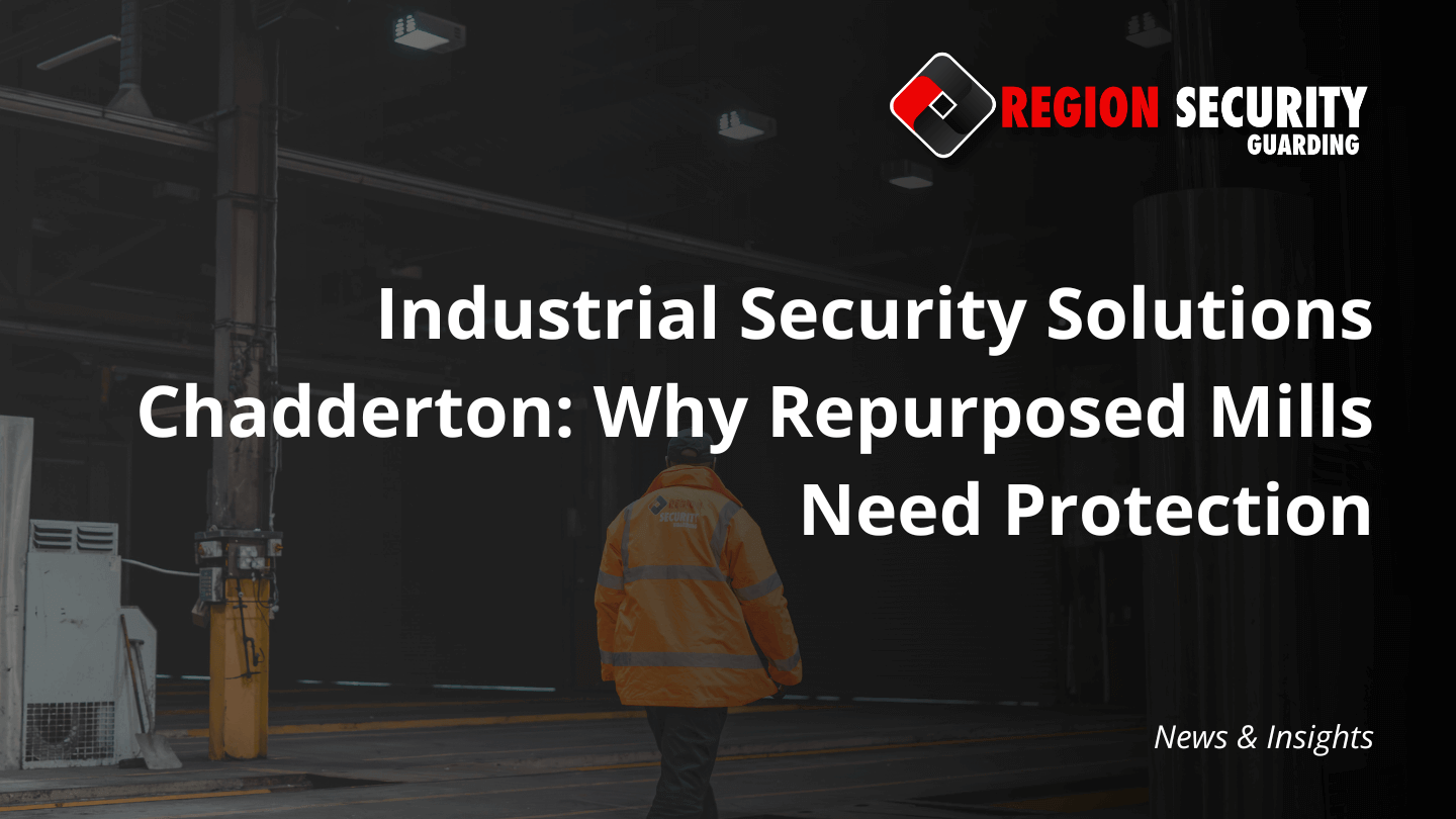 A uniformed security guard stands in a large industrial space with exposed structural elements, a classic target for industrial security solutions Chadderton.