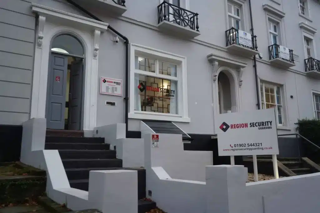 Region Security Guarding exterior signage on building — UK security company facade with branded sign