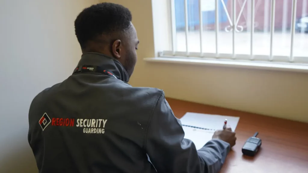Professional gatehouse security services in Birmingham with guard securing entry point
